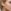 Grote Transparante Sterren-Sprankelende Epoxy Hoop Oorbel op Model Gedetailleerde close-up van een vrouwelijk model met blond haar en een transparante epoxy hoop earring gevuld met holografische sterren.